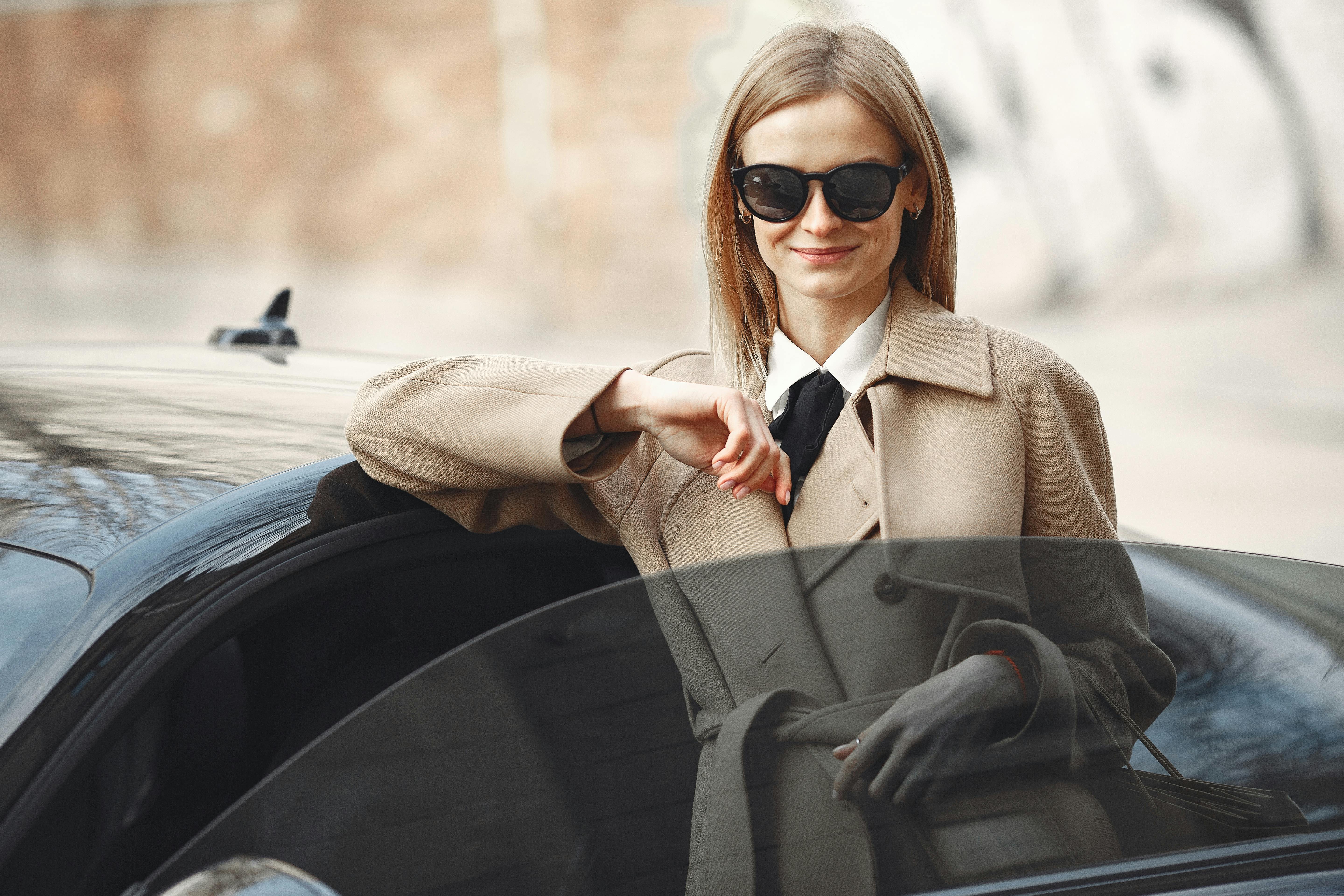 Confident adults in a luxury car